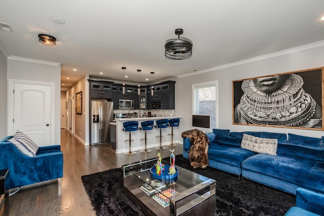 living room featuring crown molding and dark hardwood / wood-style floors