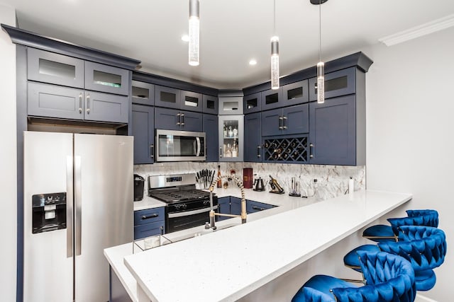 kitchen with kitchen peninsula, a kitchen breakfast bar, decorative backsplash, stainless steel appliances, and pendant lighting