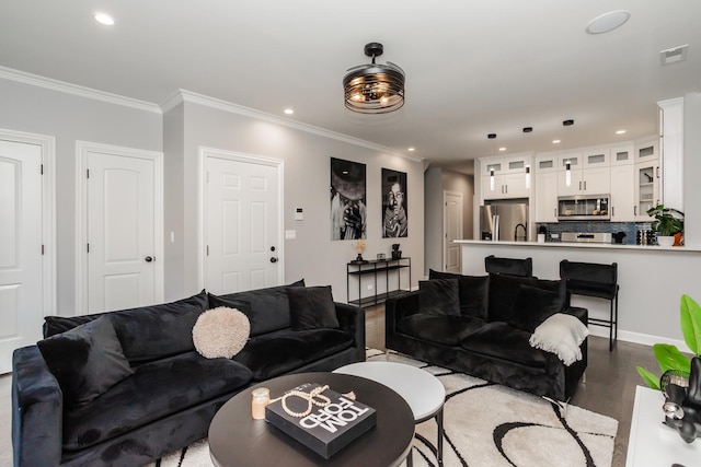 living room with light hardwood / wood-style floors and crown molding