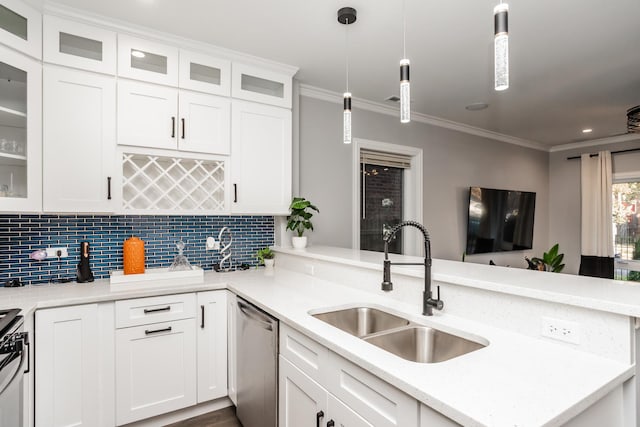 kitchen with pendant lighting, sink, stainless steel dishwasher, white cabinetry, and kitchen peninsula