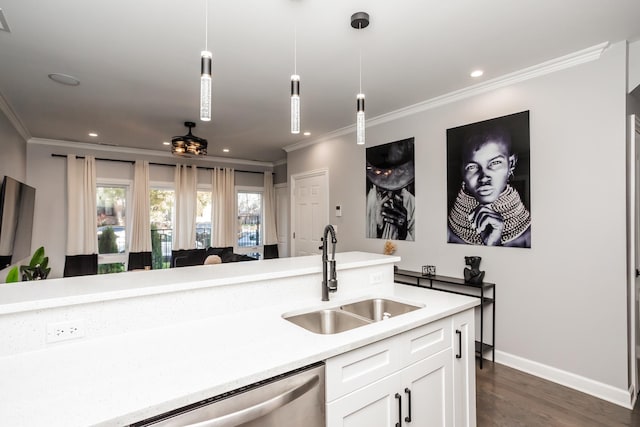 kitchen with pendant lighting, crown molding, sink, dark hardwood / wood-style flooring, and white cabinetry