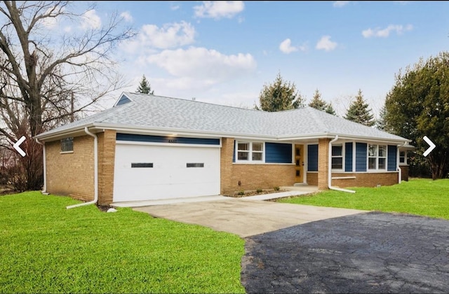 single story home with a garage and a front yard