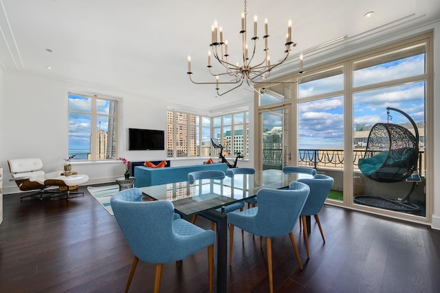 dining room featuring an inviting chandelier, dark wood-type flooring, and ornamental molding