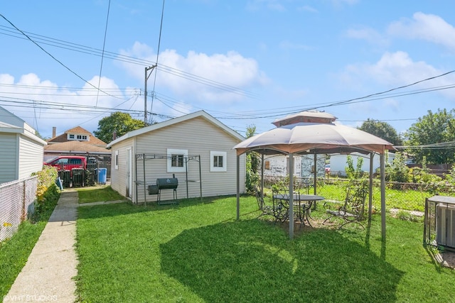 view of yard with a gazebo and central AC