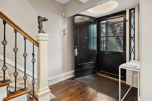 entrance foyer with dark hardwood / wood-style flooring