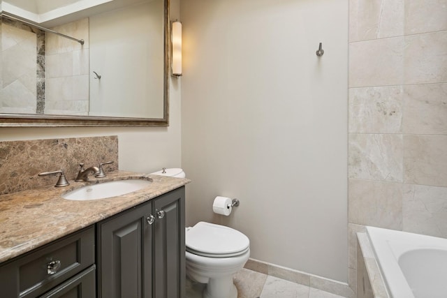 full bathroom with vanity, toilet, and tiled shower / bath