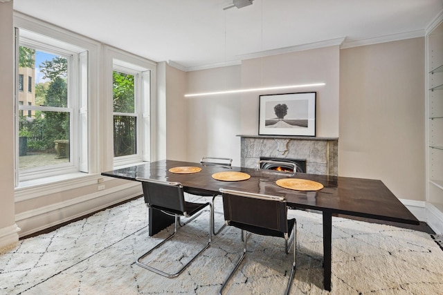 dining space with wood-type flooring and crown molding