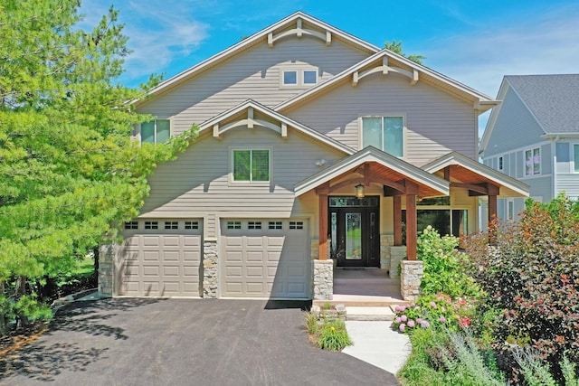 view of front facade featuring a porch and a garage