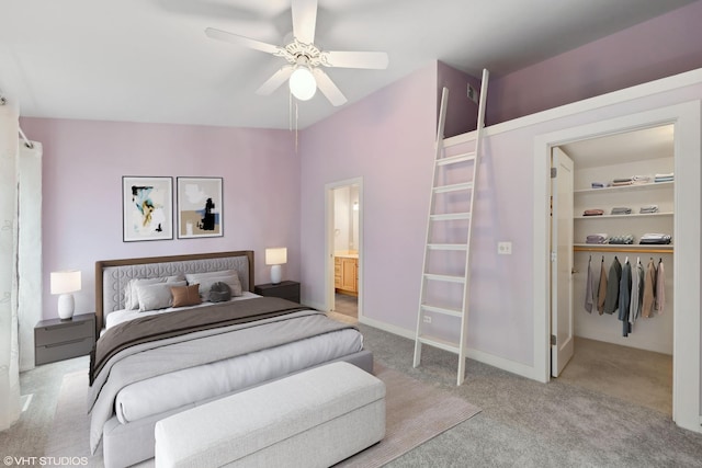 bedroom featuring ensuite bath, ceiling fan, a closet, and light carpet