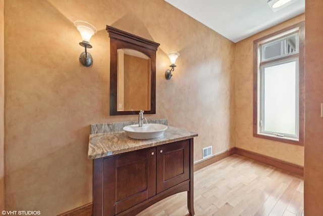 bathroom with wood-type flooring and vanity