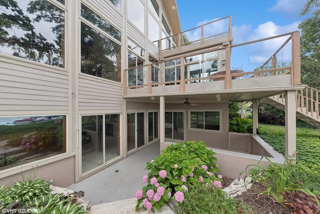 rear view of house with ceiling fan