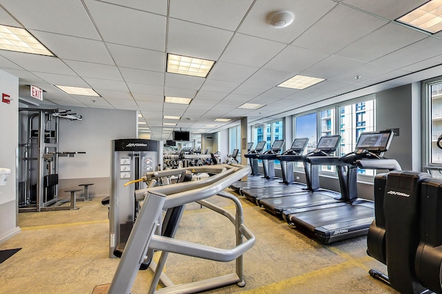 exercise room featuring a paneled ceiling