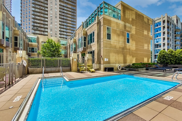 view of swimming pool with a patio