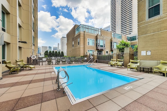 view of swimming pool featuring a patio area