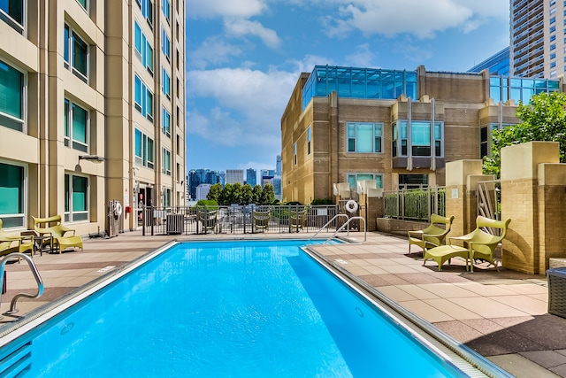 view of pool featuring a patio