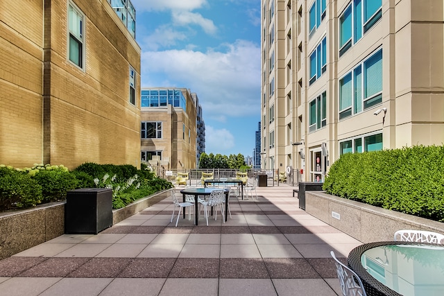 view of home's community with a patio area