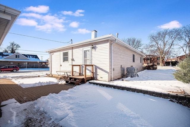 view of snow covered house