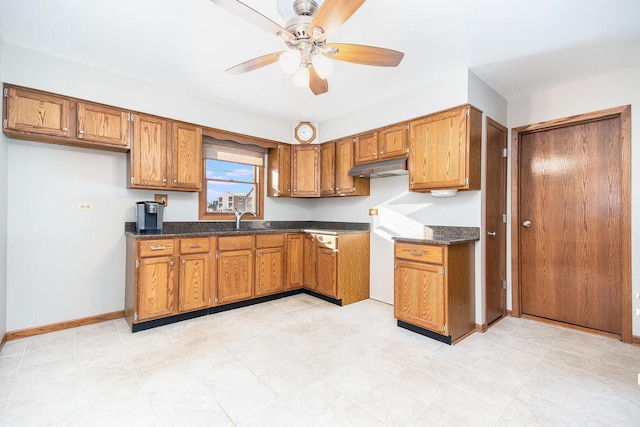 kitchen with ceiling fan and sink