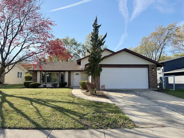 single story home featuring a garage and a front lawn