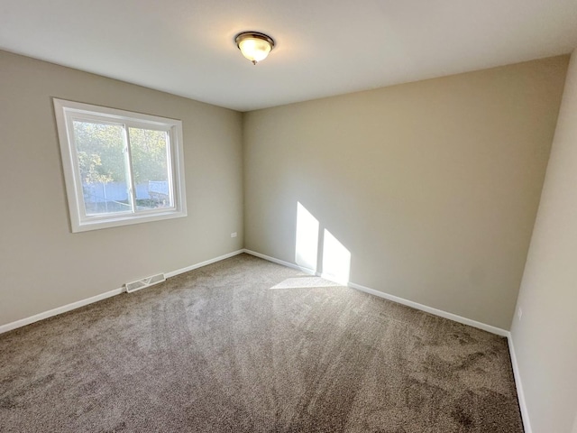 spare room with carpet flooring