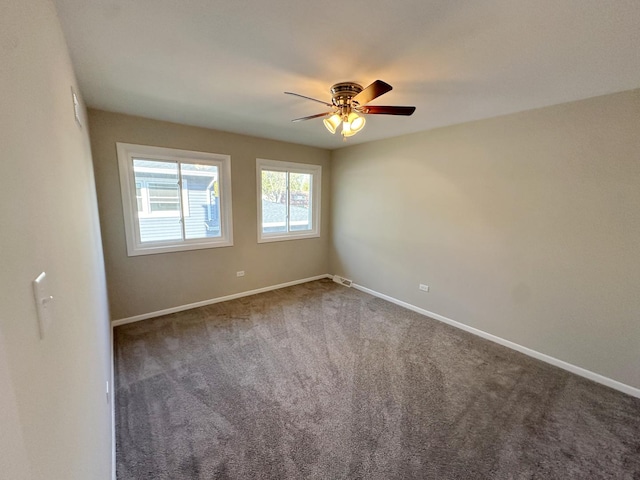 spare room with carpet flooring and ceiling fan