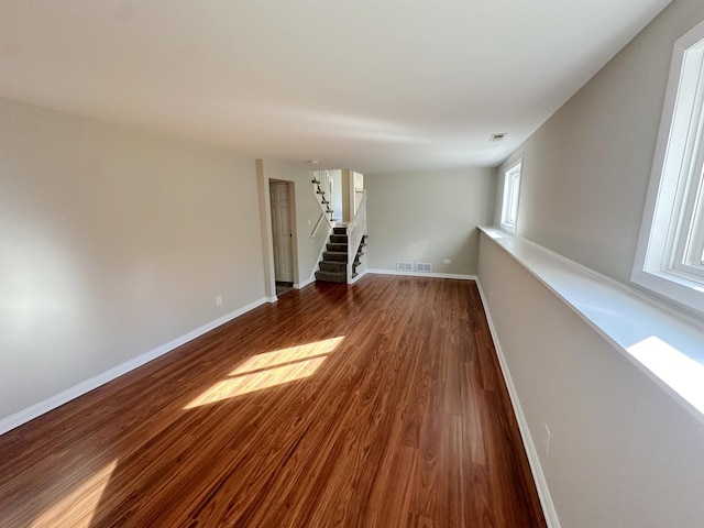 empty room featuring dark hardwood / wood-style flooring