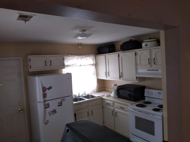 kitchen featuring sink, white cabinets, white appliances, and range hood