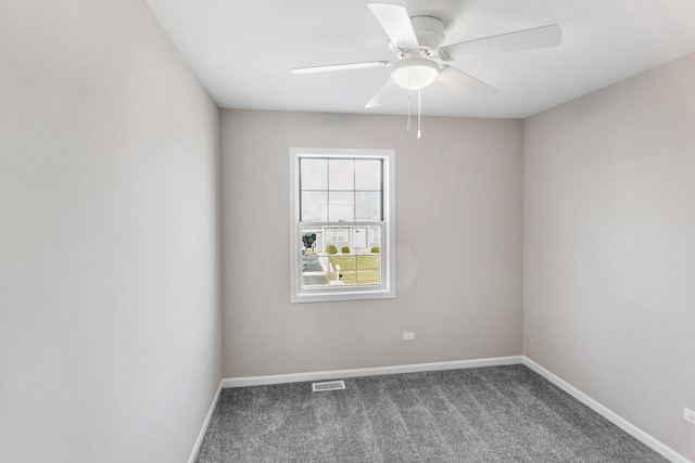 spare room featuring carpet flooring and ceiling fan