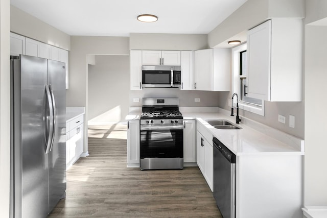 kitchen with white cabinetry, sink, and appliances with stainless steel finishes