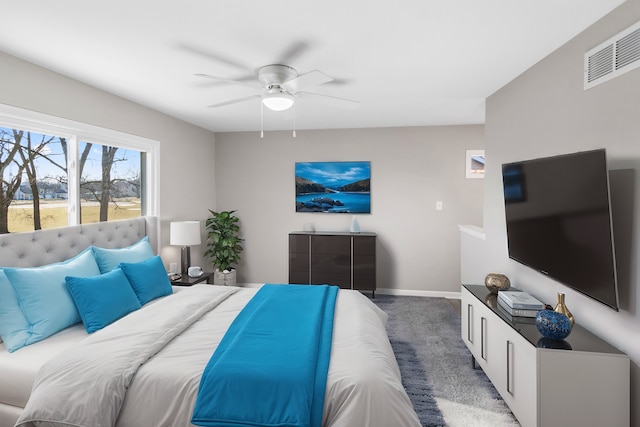 bedroom with ceiling fan and carpet floors