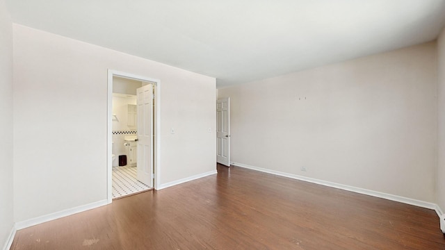 empty room with dark wood-type flooring