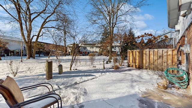 view of yard layered in snow