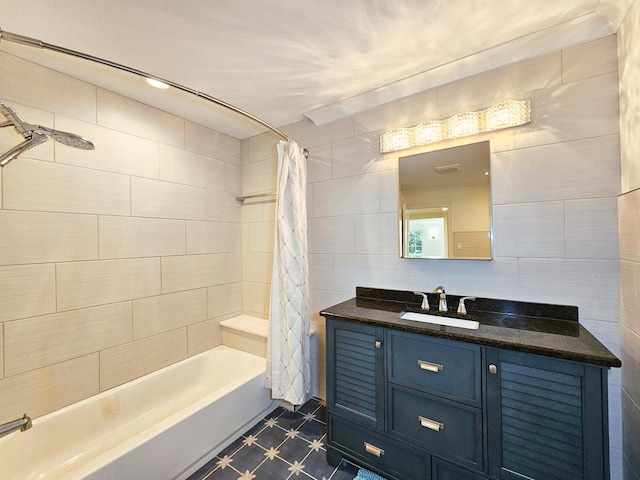 bathroom featuring shower / tub combo, tile walls, and vanity