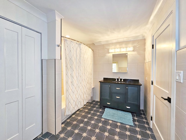 bathroom with ornamental molding, shower / tub combo, and vanity