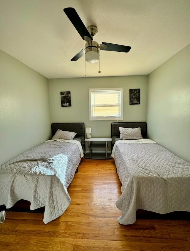 bedroom featuring ceiling fan and light hardwood / wood-style floors