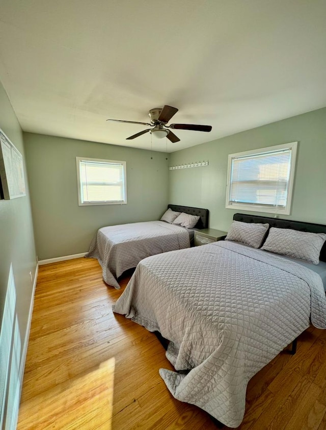 bedroom featuring ceiling fan and light wood-type flooring