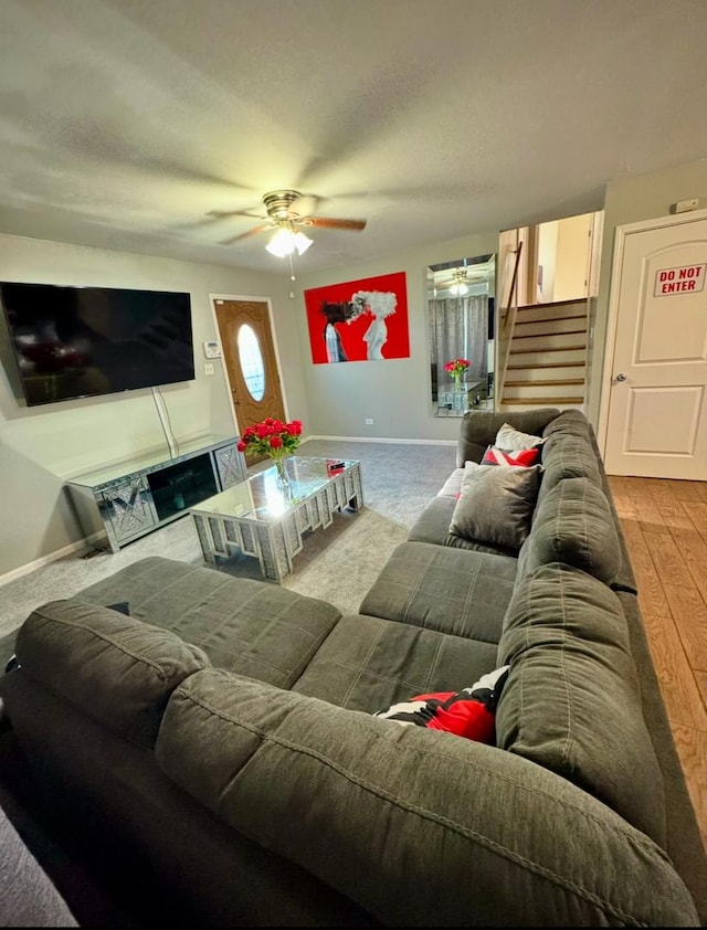 living room with ceiling fan and hardwood / wood-style floors