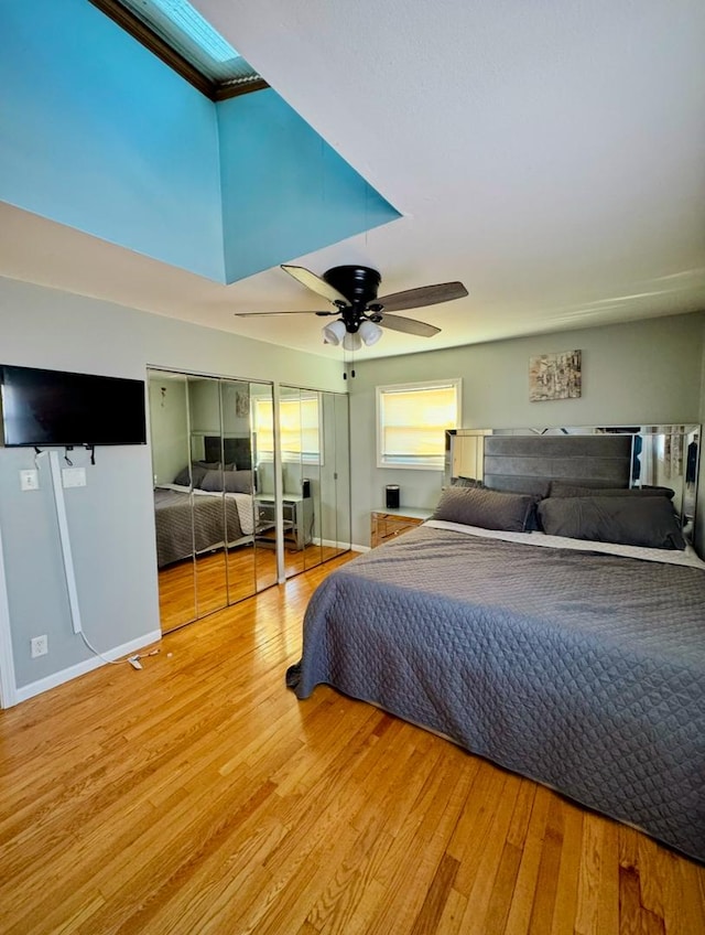 bedroom with hardwood / wood-style flooring and ceiling fan