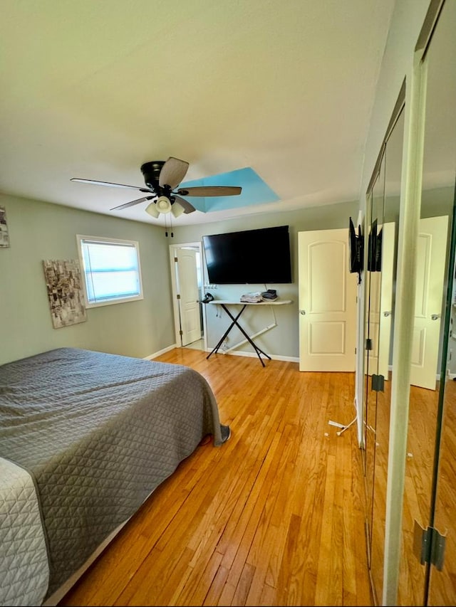 bedroom featuring ceiling fan and light hardwood / wood-style floors