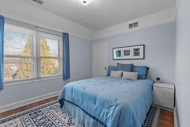 bedroom with wood-type flooring