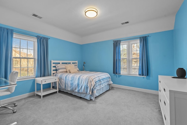 bedroom featuring light carpet