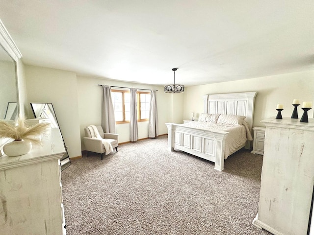 bedroom featuring carpet flooring and a notable chandelier