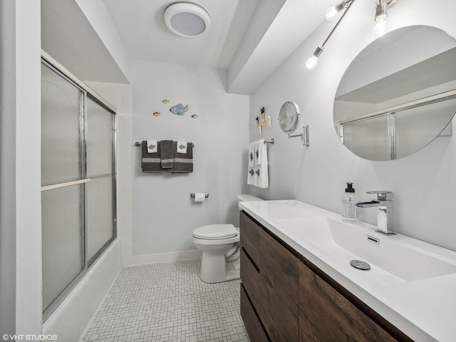 full bathroom with shower / bath combination with glass door, vanity, tile patterned floors, and toilet