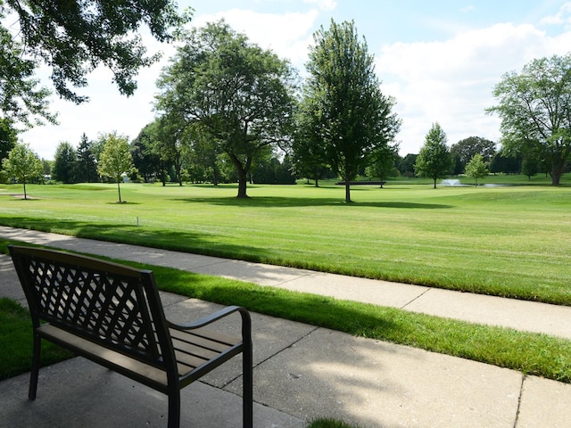 view of home's community featuring a lawn