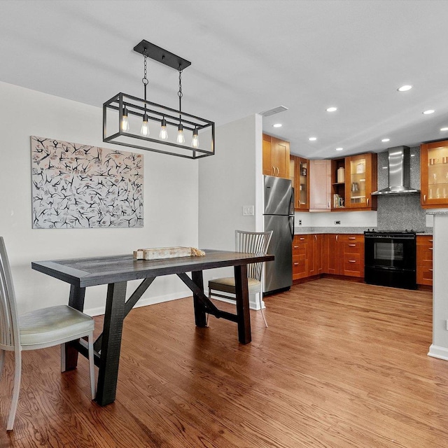 dining room with light hardwood / wood-style floors