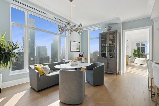 dining room featuring a notable chandelier and light wood-type flooring