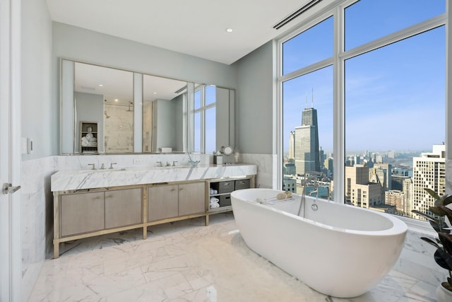 bathroom featuring vanity and plus walk in shower