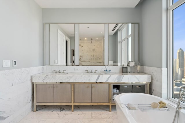 bathroom featuring vanity, separate shower and tub, and tile walls