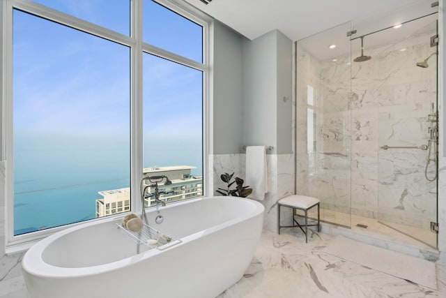 bathroom featuring a water view, separate shower and tub, and floor to ceiling windows