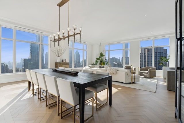 dining space with a chandelier and light parquet floors